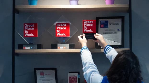 Great Place To Work awards on the Cheesecake Labs office shelf