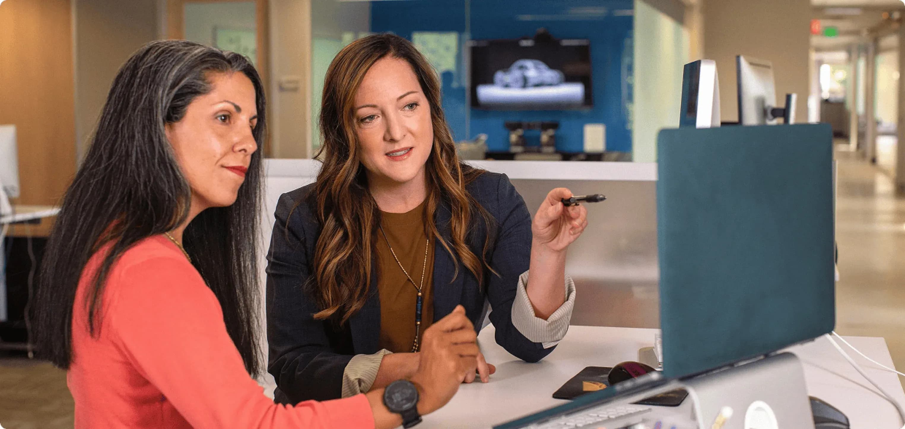 Private Equity — two professionals reviewing performance in a meeting